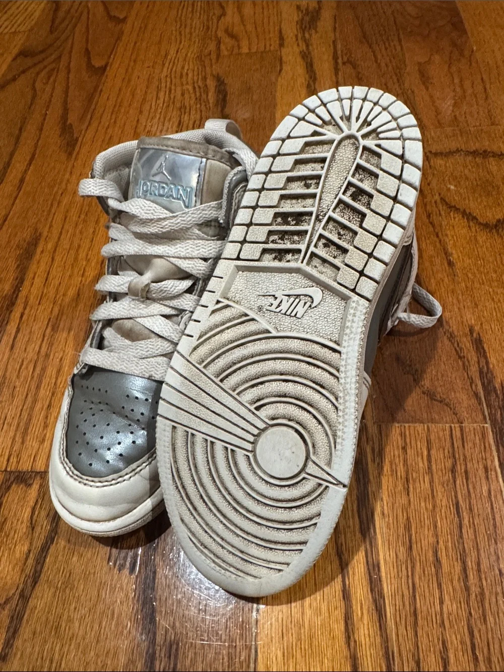 Nike Kids Air Jordan high top Sneakers in White, Silver, and Black